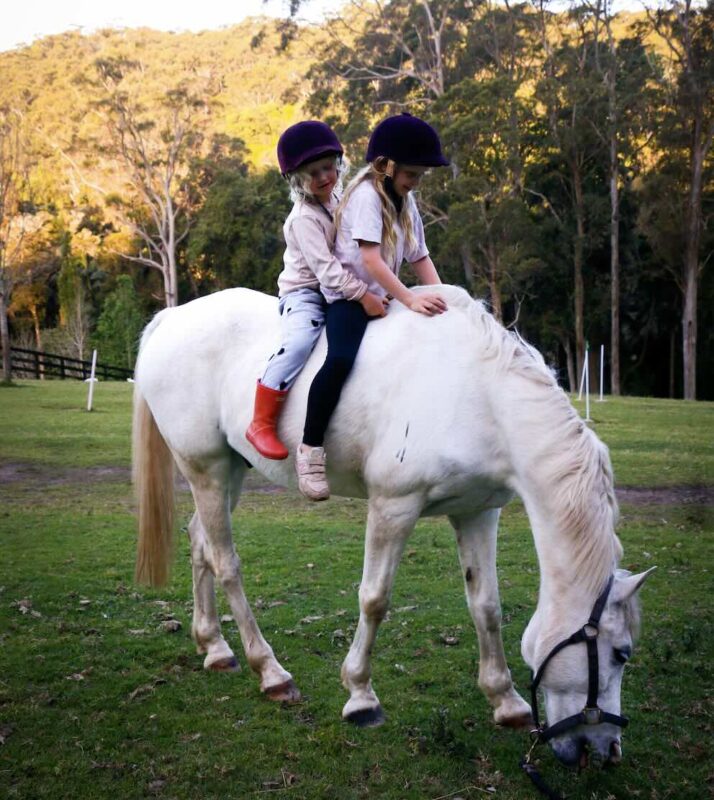 Activities on the Central Coast: Children with horses at The Outlook Riding Academy, Terrigal, Central Coast NSW.